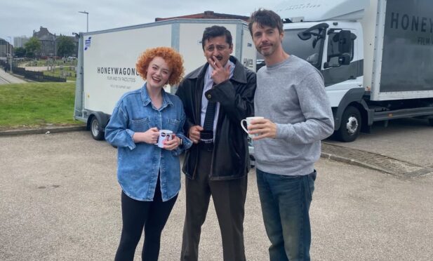 (L-R) Department Q Stars Leah Byrne, Alexej Manvelov and Matthew Goode spoke with the owner of the motorcycle school during production. Image: CMS Bike School
