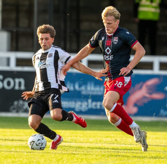 Elgin City's Liam Scullion, left, challenges Ross County's Adam Macleod in the KDM Evolution Trophy tie against Elgin City at Borough Briggs Stadium, Elgin, on August 11, 2026.