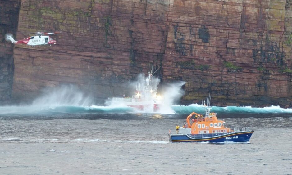 Seventeen rescued from fishing boat run aground off Orkney