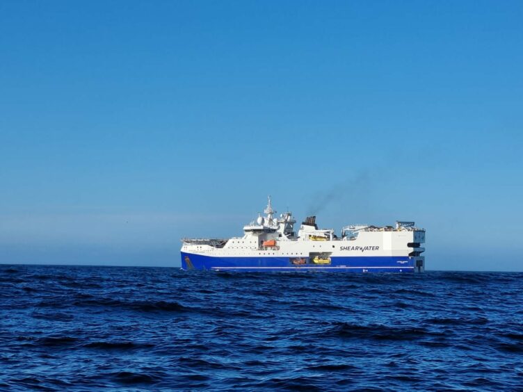 Big ship on blue sea under blue sky