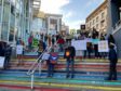Protestors stand on steps in Cape Town