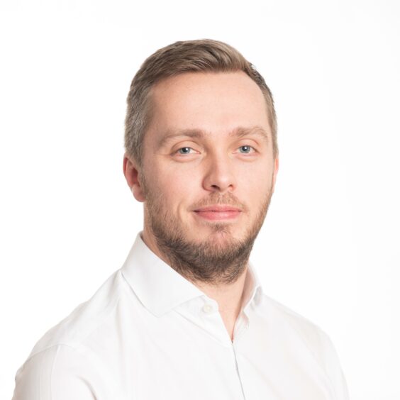 Headshot of man in white shirt