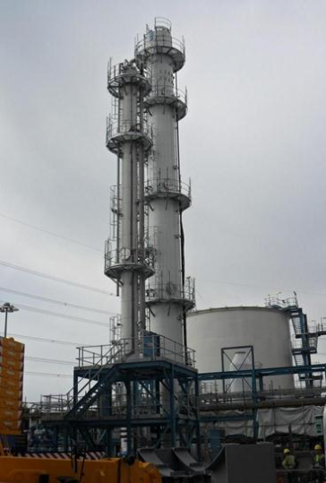 Industrial tower against a cloudy background