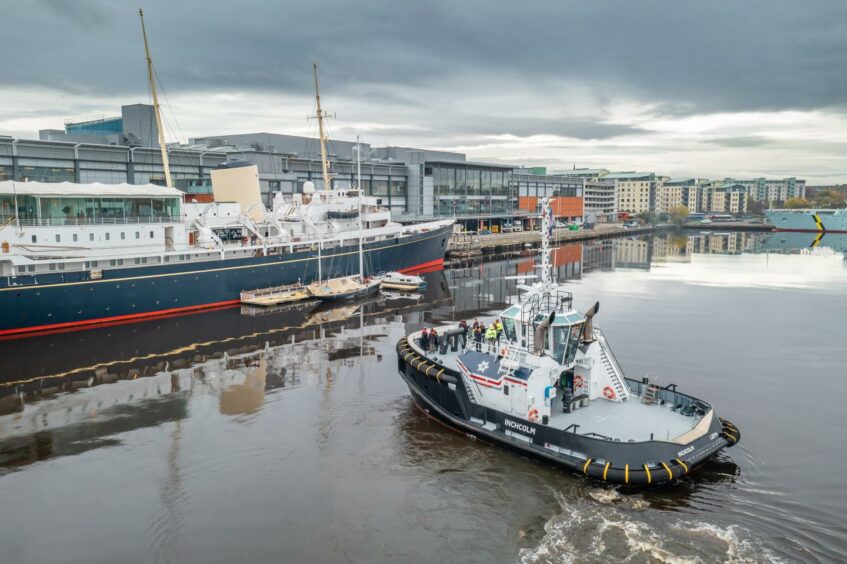 A delegation from BP, EnBW and Forth Ports aboard The Inchcolm, while on an in-dock tour of The Port of Leith. The Royal Yacht Britannia is also pictured. Supplied by Port of Leith/Airborne Lens Date; 08/11/2021