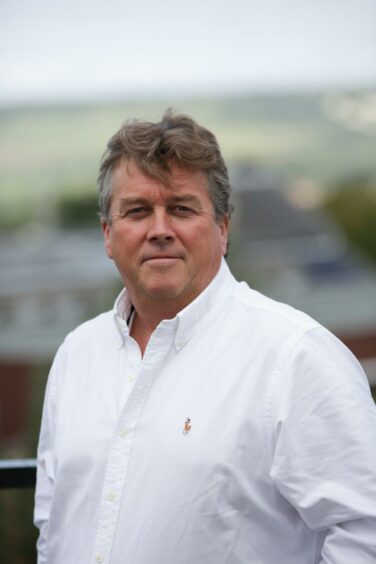 Head shot of man in white shirt