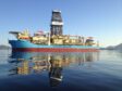 Drillship with reflection on blue water