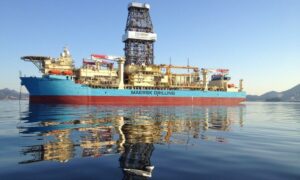 Drillship with reflection on blue water