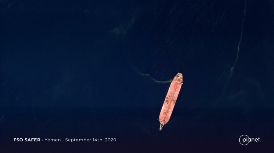 Satellite picture of a ship in a dark blue sea