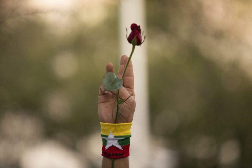 A demonstrator gives with the three-finger salute during a protest outside the United Nations Building in Bangkok, Thailand, on Thursday, March 4, 2021. The U.S. criticized Myanmar's security forces for using deadly force against anti-coup protesters as the United Nations said another 38 protesters were killed across the country on March 3, 2021. Photographer: Andre Malerba/Bloomberg