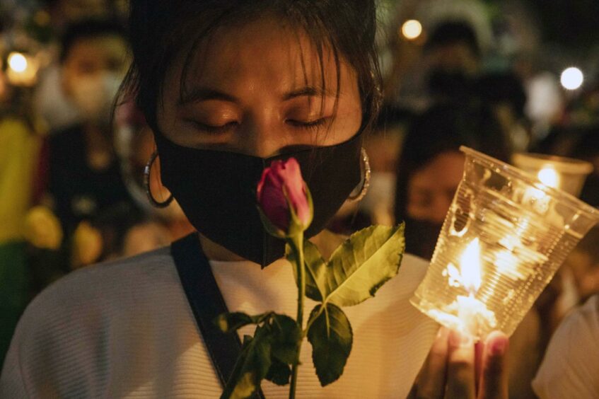 A demonstrator observes a moment of silence during a protest outside the United Nations Building in Bangkok, Thailand, on Thursday, March 4, 2021. The U.S. criticized Myanmar's security forces for using deadly force against anti-coup protesters as the United Nations said another 38 protesters were killed across the country on March 3. Photographer: Andre Malerba/Bloomberg