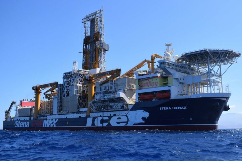 A drillship, with Stena on the side, on a blue sea