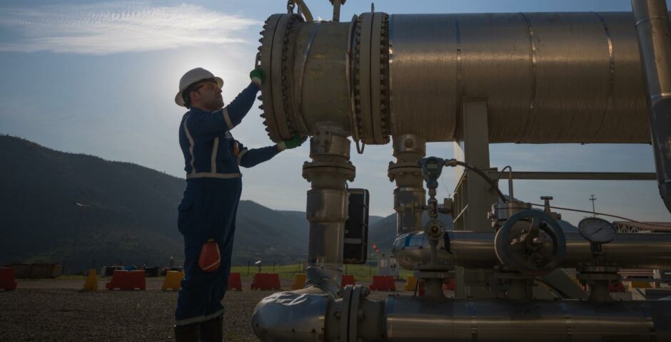 Worker stands at end of big pipe