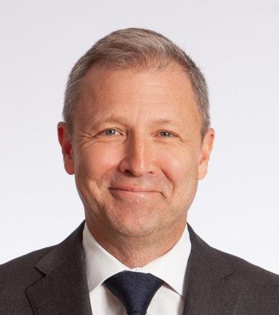 Head shot of man with tie on white background