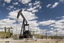 Oil well pump jacks operated by Chevron Corp. in San Ardo, California, U.S., on Tuesday, April 27, 2021.