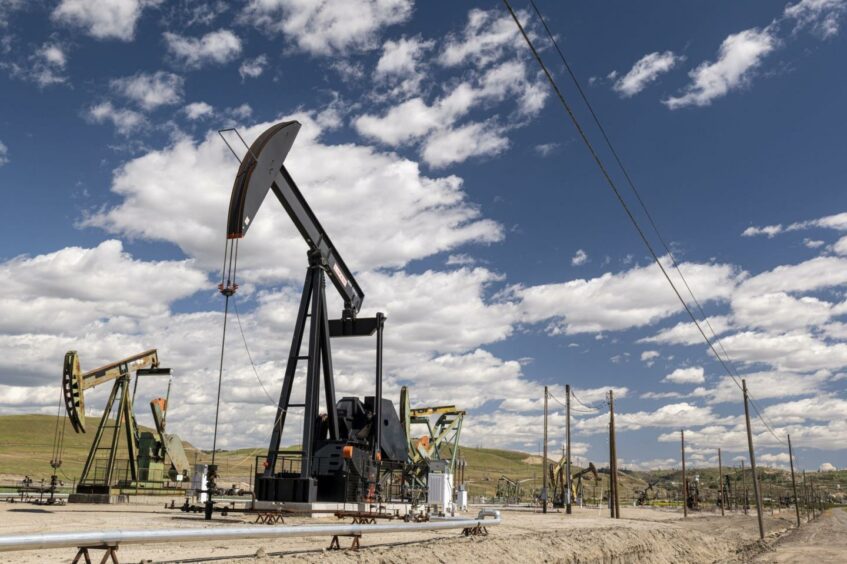 Oil well pump jacks operated by Chevron Corp. in San Ardo, California, U.S., on Tuesday, April 27, 2021.
