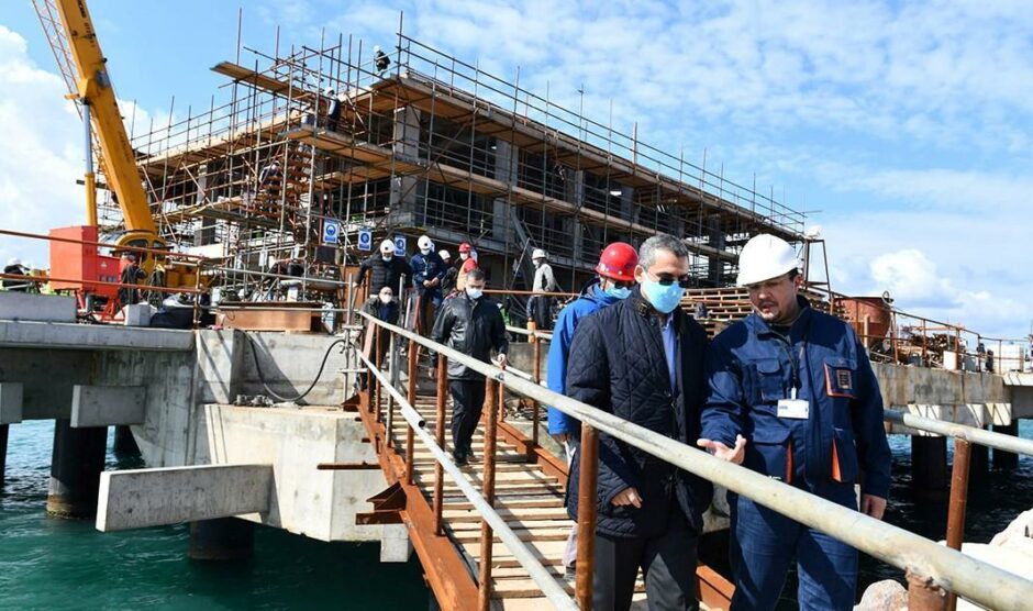 Workers talking on gangway