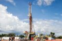 Onshore drilling rig under blue sky