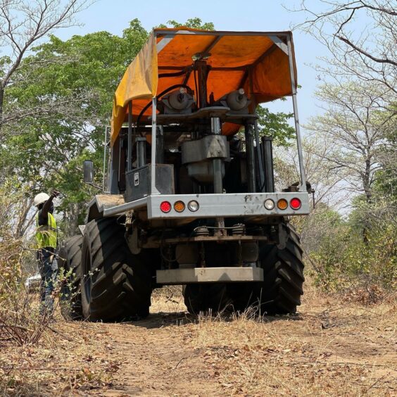 Truck with orange roof in brush