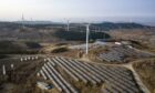 Wind turbines and solar panels in Liaoning Province. Photographer: Qilai Shen/Bloomberg