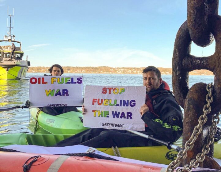 Greenpeace activists Andreas Randoy and Halvard Raavand at the Ust Laga. Oslo Fjord, Norway.