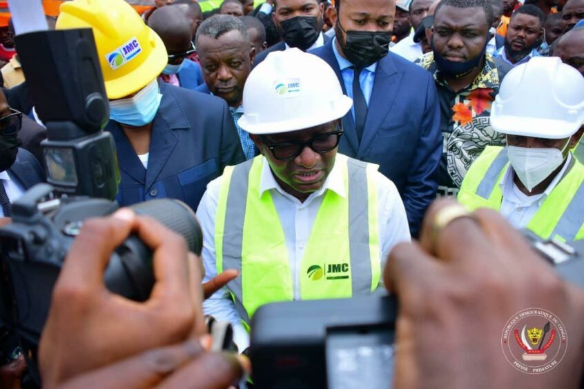 Man in hard hat addresses reporters