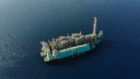 Aerial view of FLNG vessel in blue waters