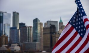 American Flag with Manhattan in background.