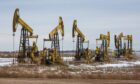 Oil pumping jacks, also known as 'nodding donkeys'in a Rosneft Oil Co. oilfield near Sokolovka village, in the Udmurt Republic, Russia, on Friday, Nov. 20, 2020. The flaring coronavirus outbreak will be a key issue for OPEC+ when it meets at the end of the month to decide on whether to delay a planned easing of cuts early next year. Photographer: Andrey Rudakov/Bloomberg
