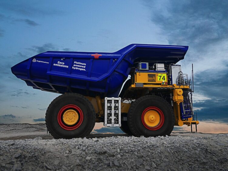 Big blue truck with orange hub caps