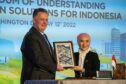 Picture shows; Jay Pryor, Vice President of Corporate Business Development for Chevron, and Nicke Widyawati, President Director & CEO of PT Pertamina (Persero), commemorate the signing of an MoU to explore lower carbon opportunities in Indonesia.