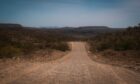 Dusty road stretches into distance