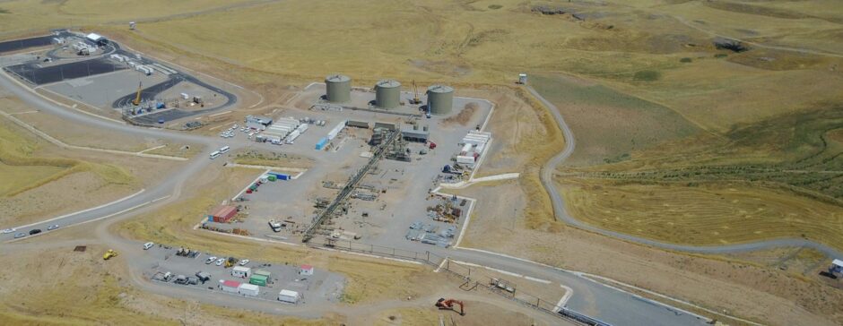 Aerial shot of industrial facilities amid grass