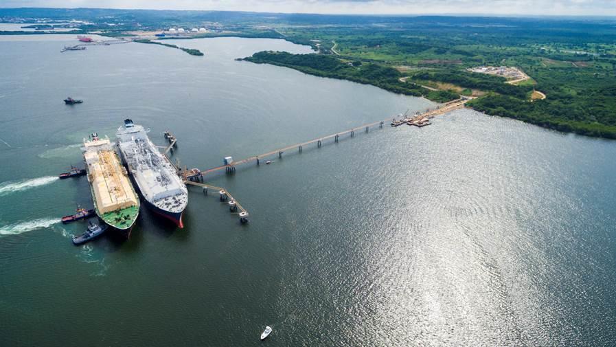 Aerial shot of two big ships connected to the shore