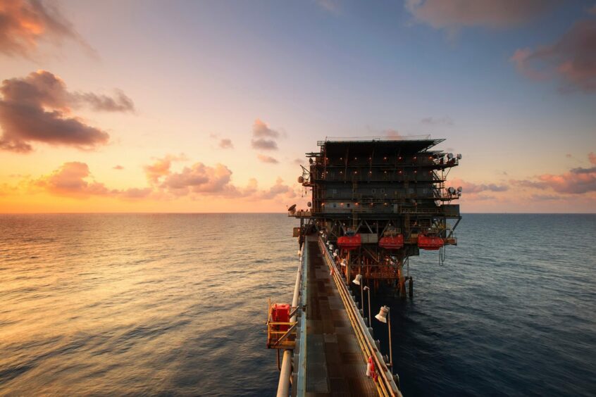 Offshore platform on body of water.
