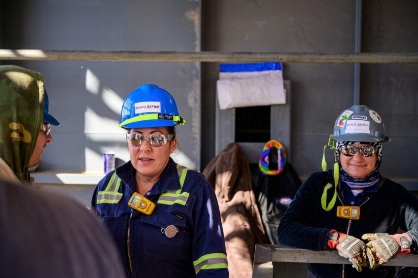 Workers in blue hats