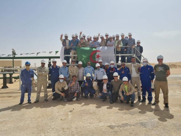 Workers celebrate in a desert