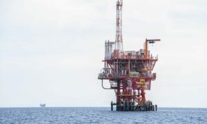 Rig in sea with banners on