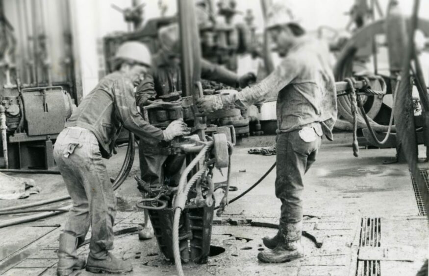 Historical photograph of workers at Erawan