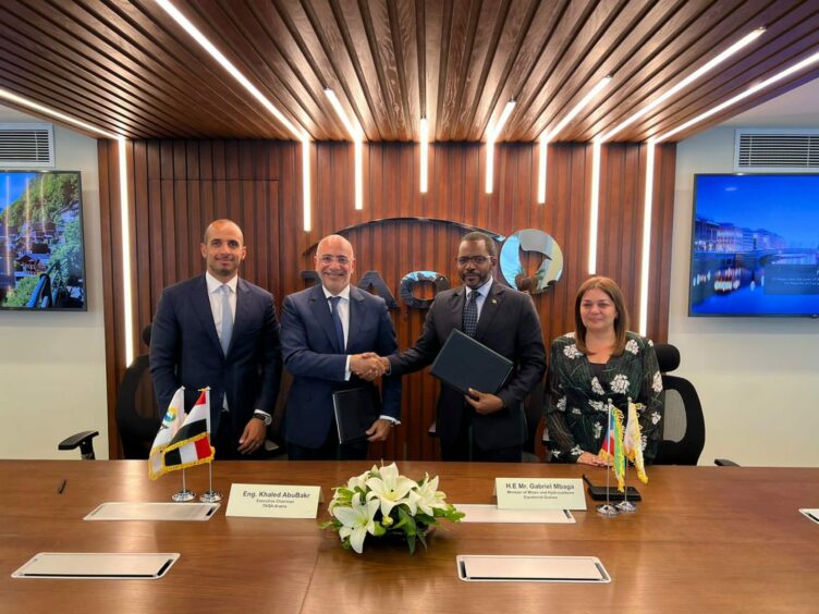 Four people behind a desk