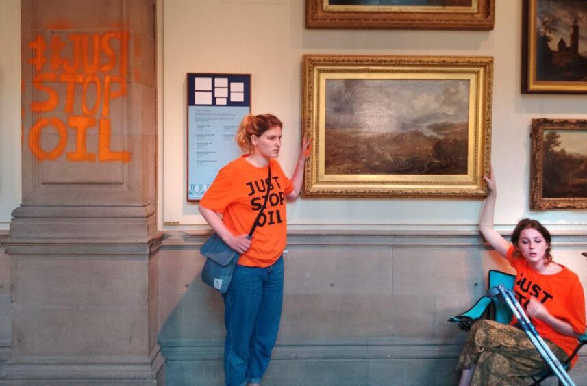 (L-R) Just Stop Oil protestors Carmen Lean and Hannah Torrance Bright glued themselves to the frame of a 19th century artwork.