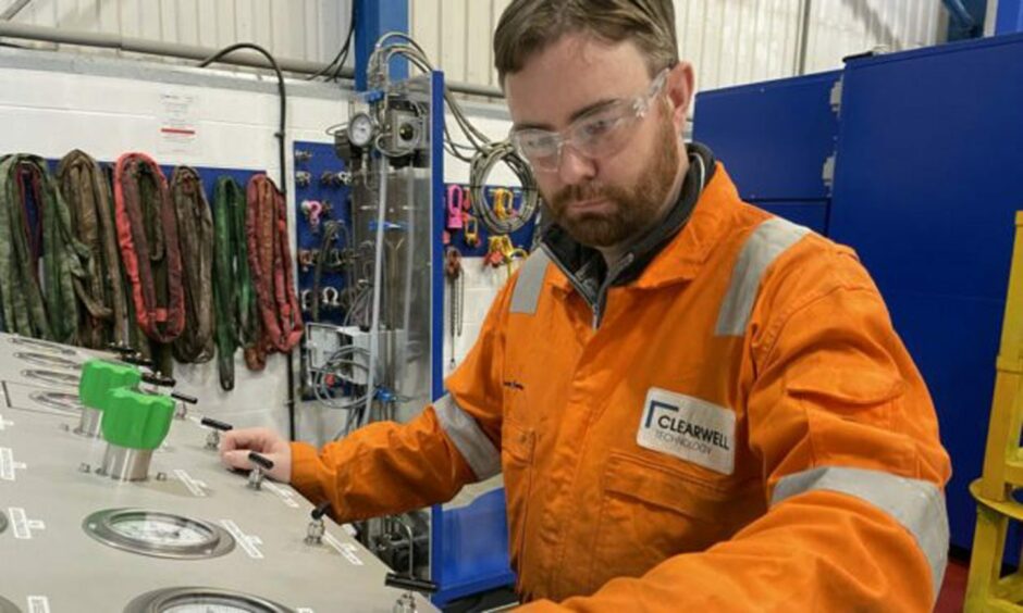 Clearwell Technology director Bruce Cardno performing testing using the company's high-pressure test cell.