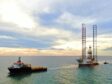 Jack-up drilling rig being towed offshore Malaysia.
