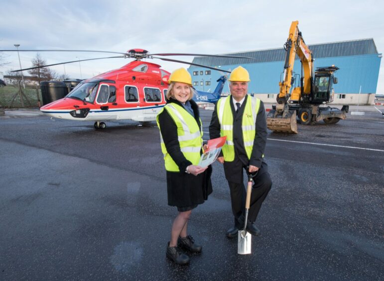 Oil and Gas UK chief executive Deirdre Michie with Mark Abbey, regional director, Europe, the Middle East and Africa, at CHC Helicopter in January 2018.