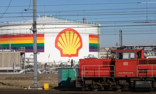 A freight train near a storage tank in the Shell Plc refinery at the Port of Rotterdam in Rotterdam, Netherlands, on Tuesday, March 8, 2022.