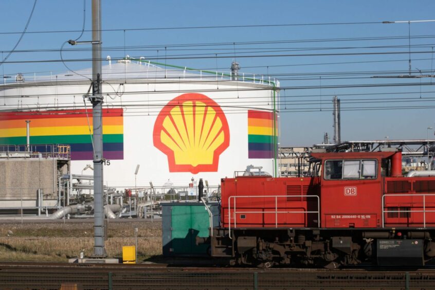 A freight train near a storage tank in the Shell Plc refinery at the Port of Rotterdam in Rotterdam, Netherlands, on Tuesday, March 8, 2022.