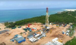 Aerial shot of drilling rig by the coast