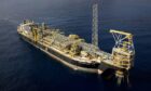 Aerial view of an FPSO on dark blue water