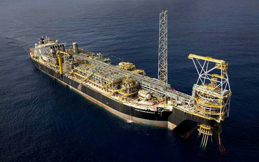 Aerial view of an FPSO on dark blue water
