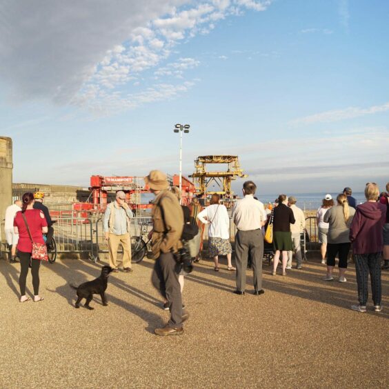 A crowd gathers to watch the SEE Monster platform being brought ashore. Weston-Super-Mare.
