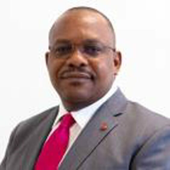 Head shot of man with red tie 